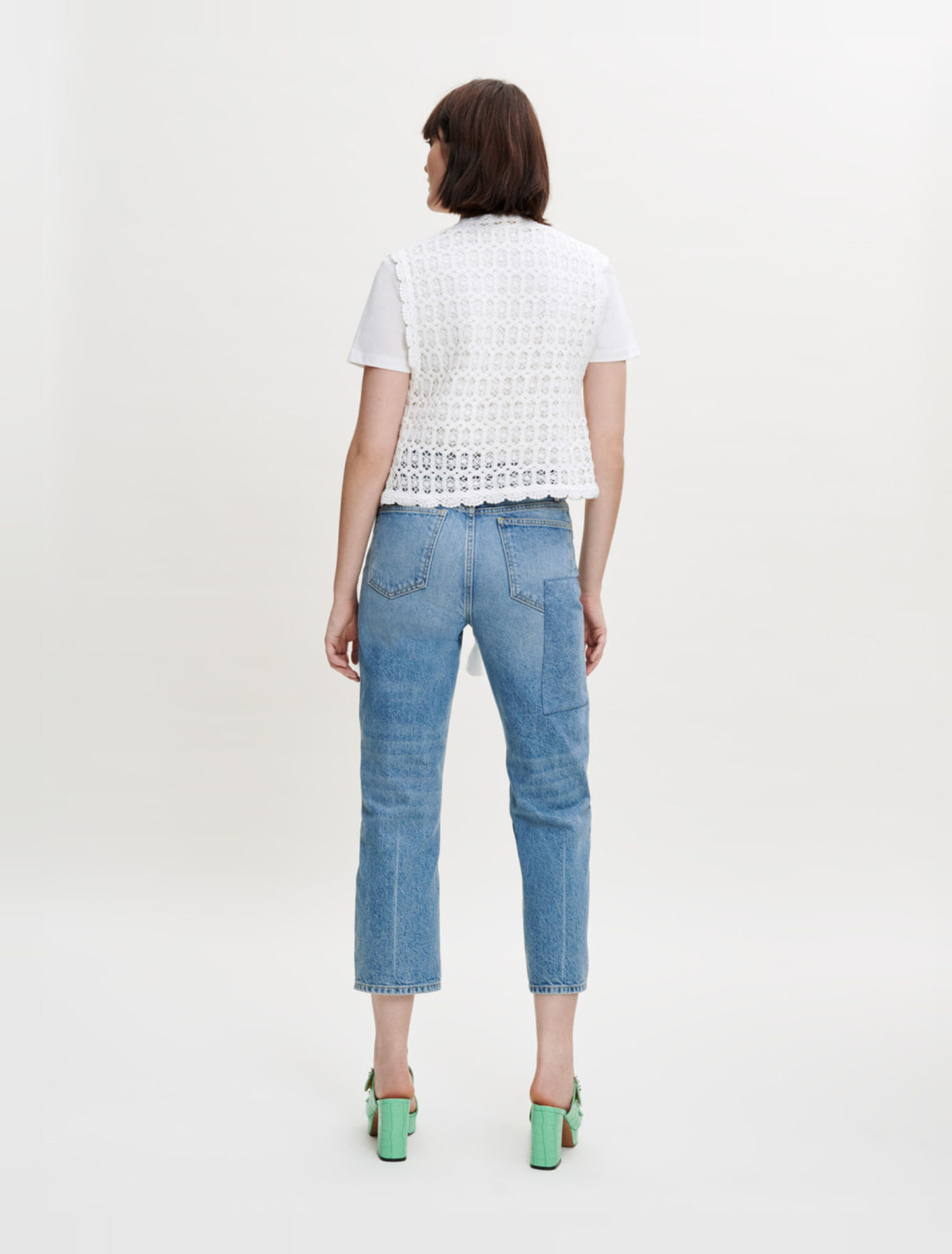 Petite veste sans manche en guipure