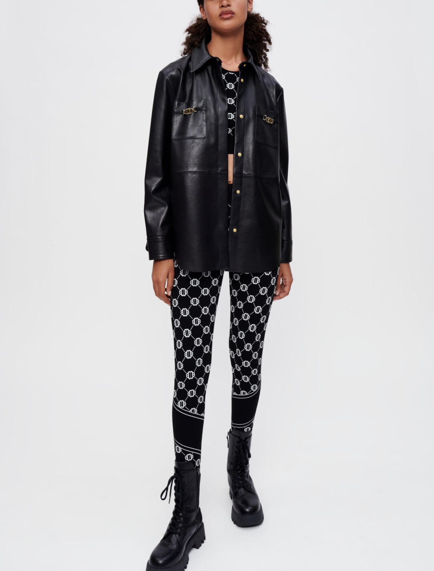 Chemise en cuir noir à mors dorés