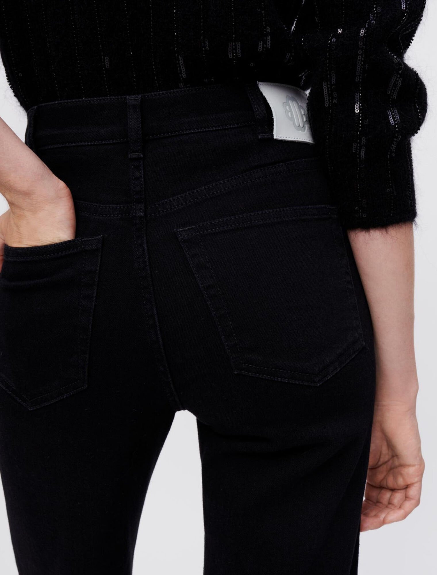 Jean noir taille haute déchiré en bas