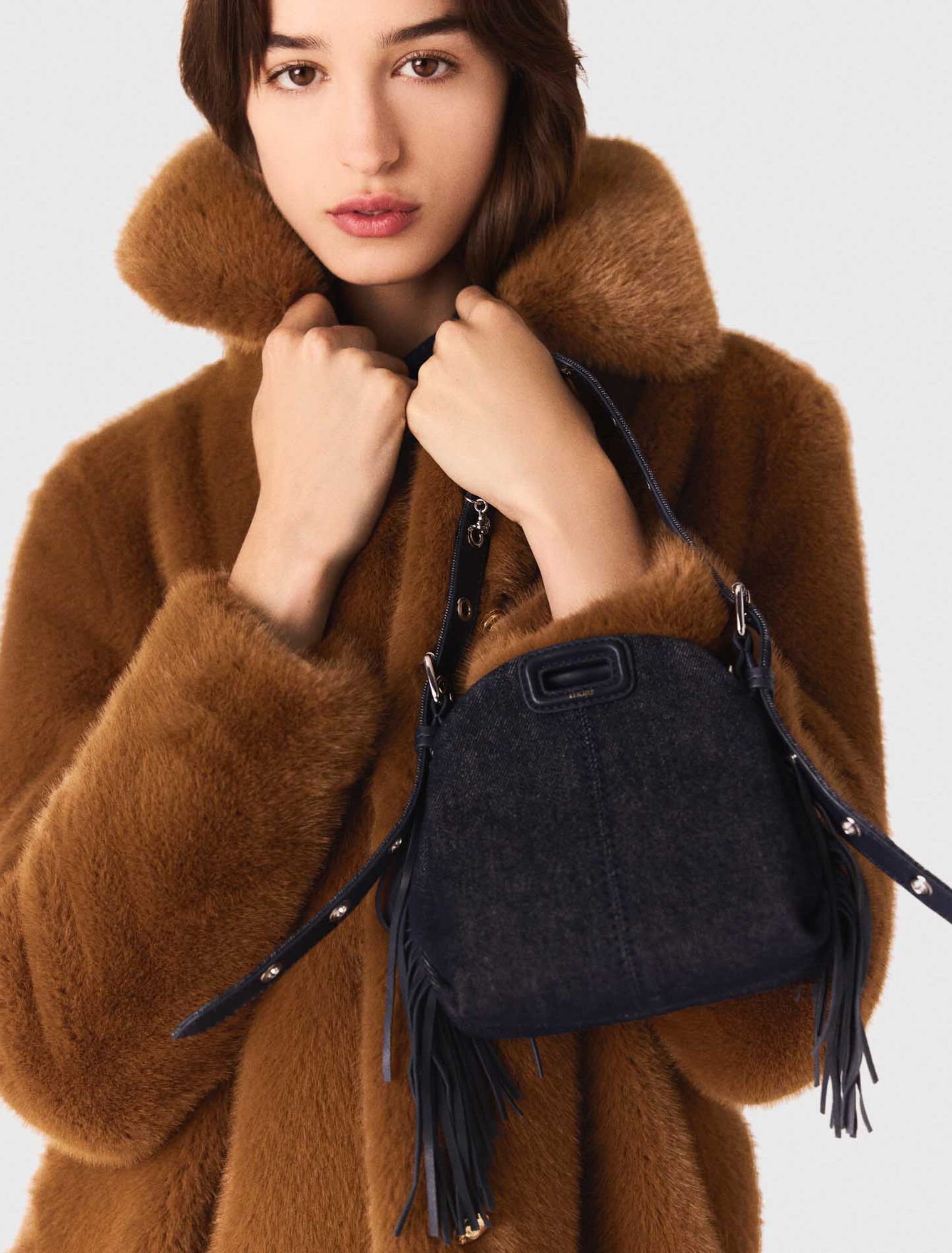 Manteau mi-long en fausse fourrure