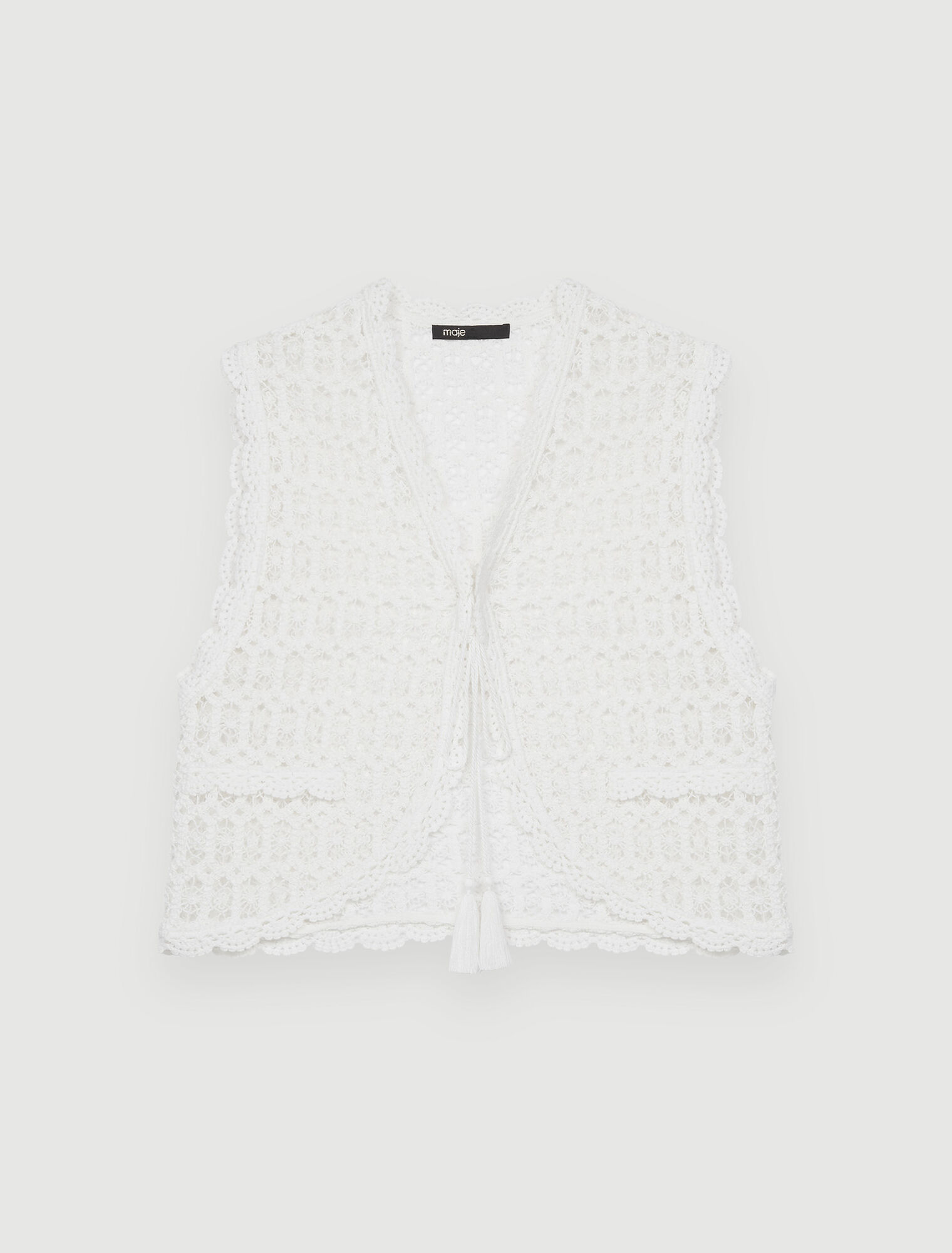 Petite veste sans manche en guipure
