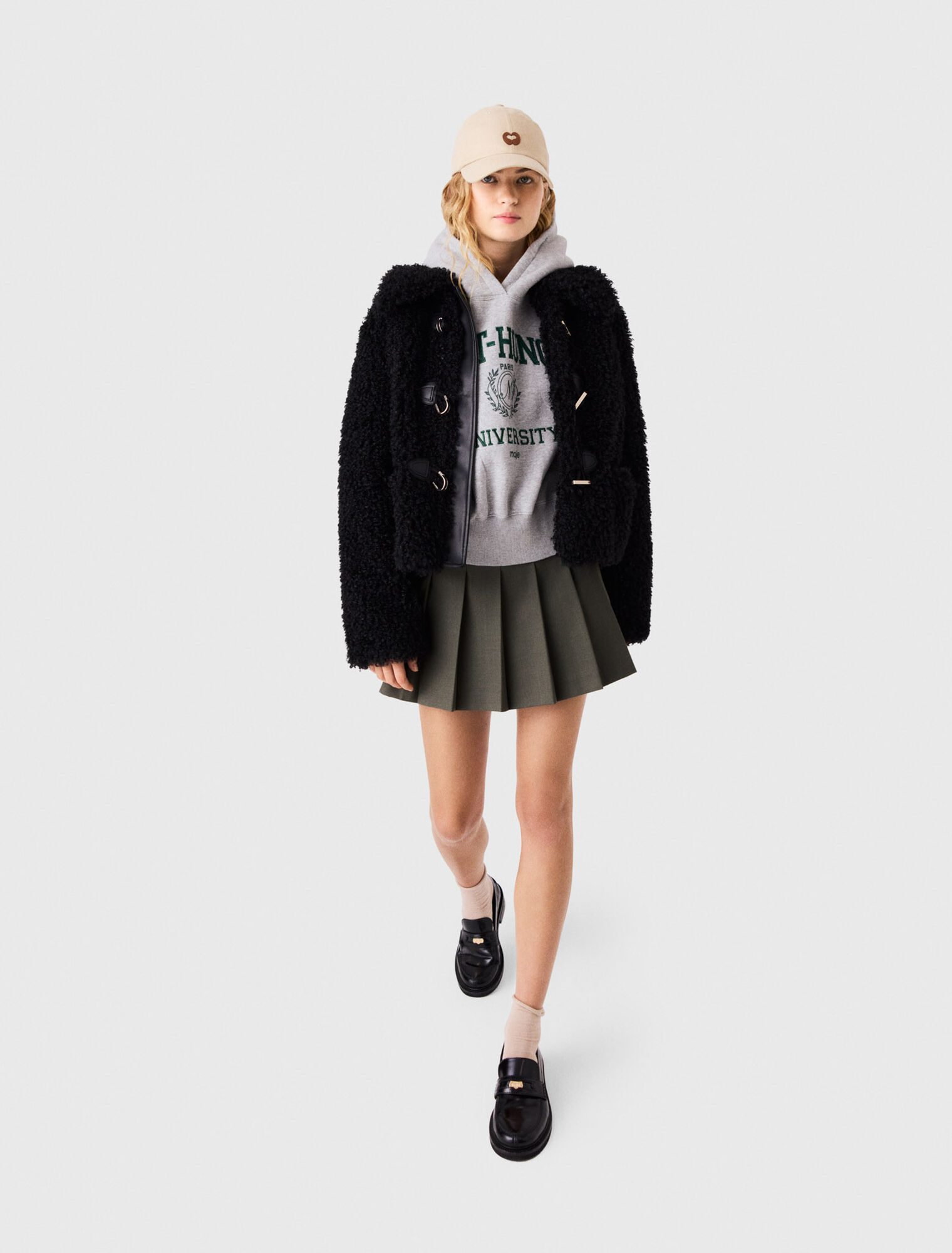 Blouson en fausse fourrure boucl&eacute;e