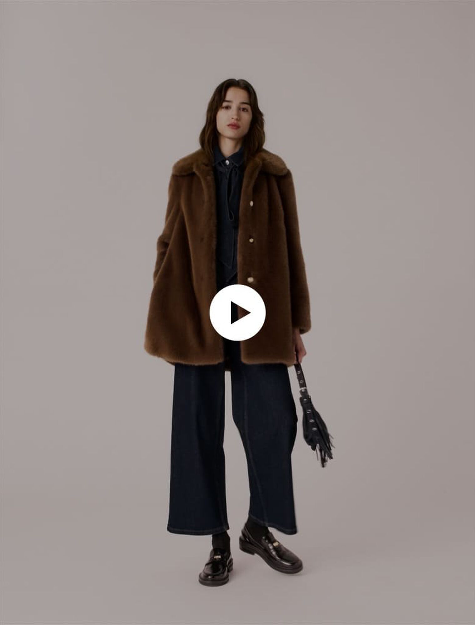 Manteau mi-long en fausse fourrure