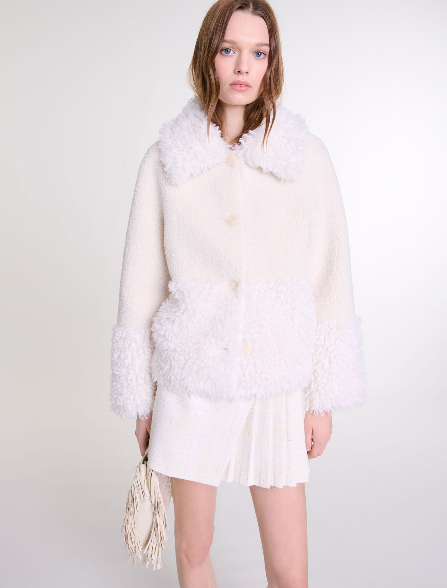 Manteau court fausse fourrure