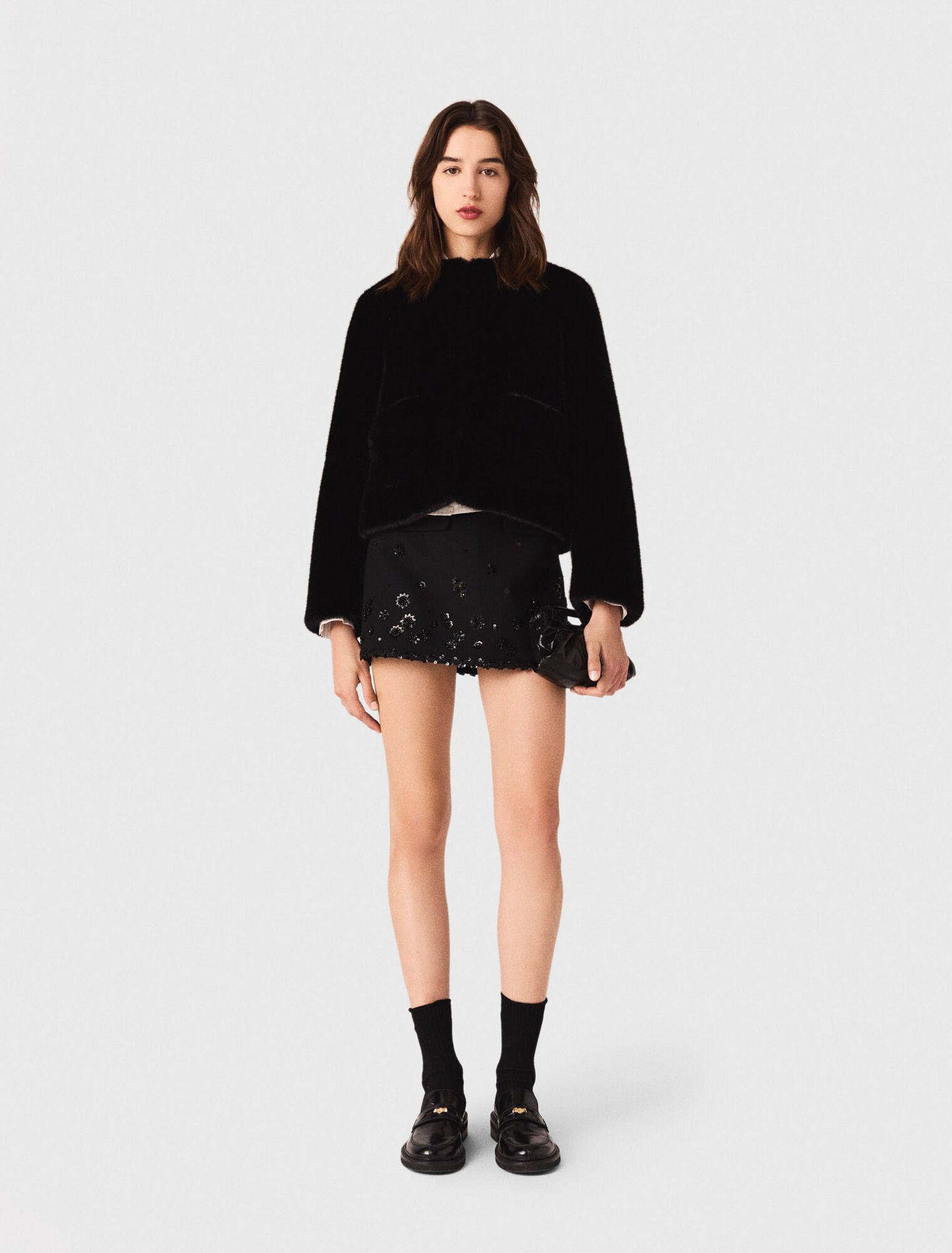 Manteau court en fausse fourrure