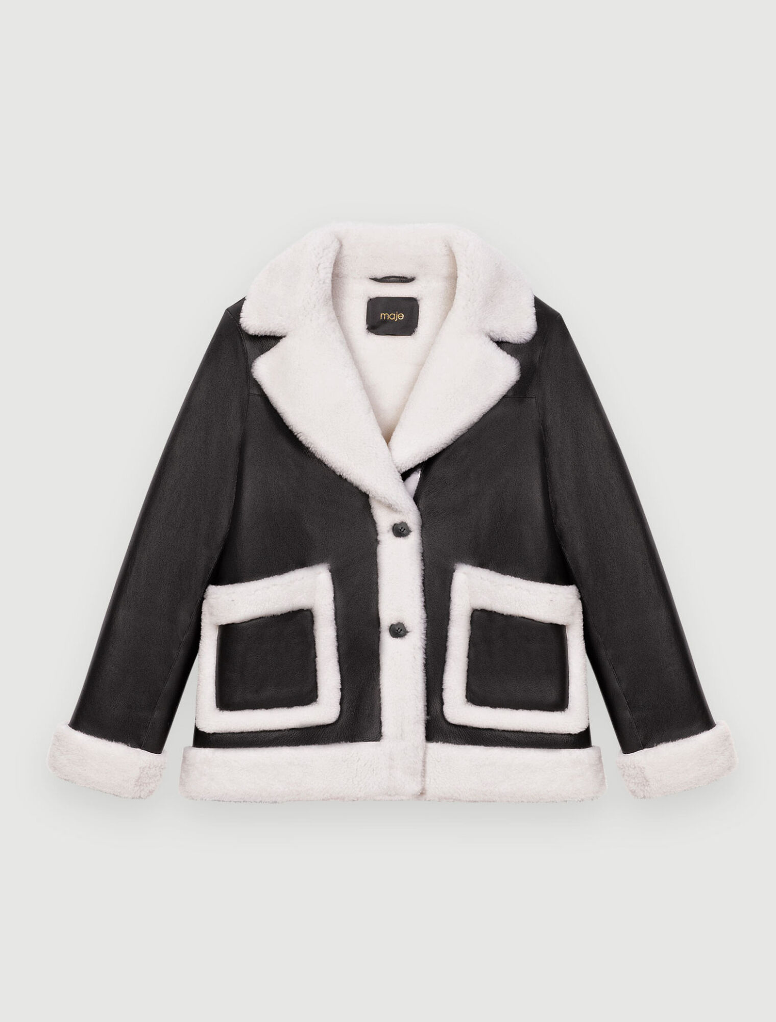 Manteau en peau lainée bicolore