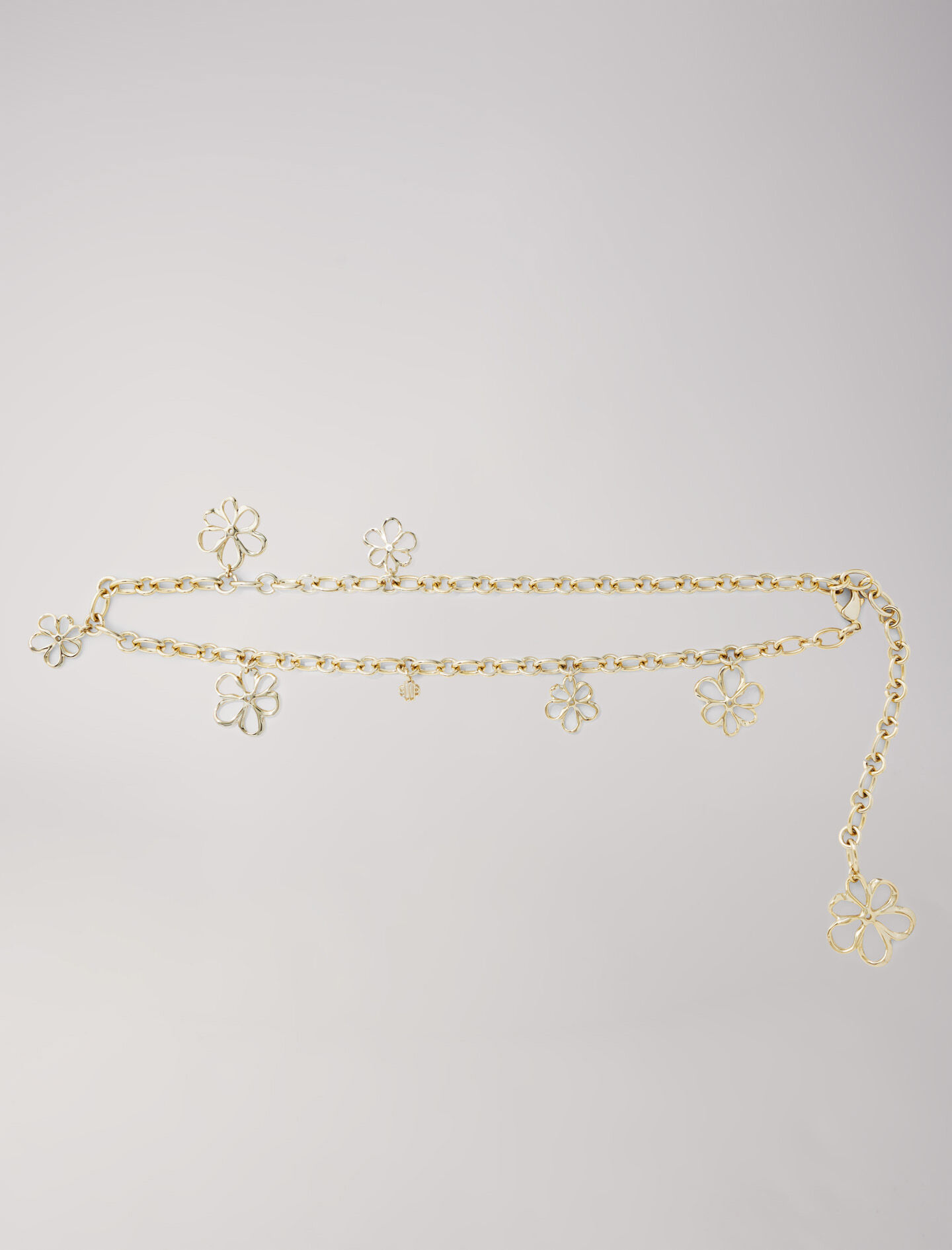 Ceinture chaine ornee de fleurs