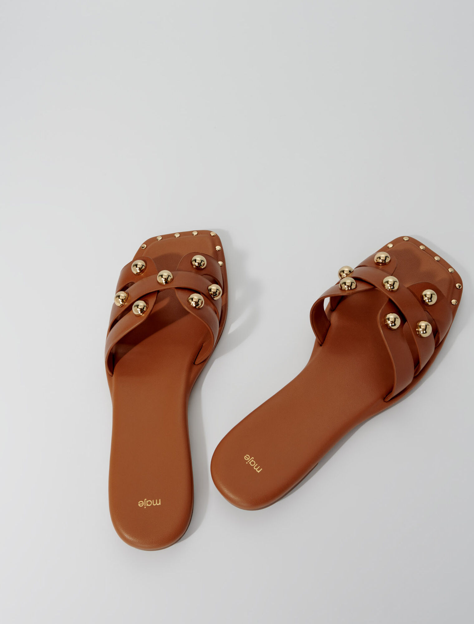 Mules en cuir ornées de studs