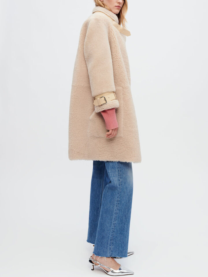 Manteau en peau lainée et cuir