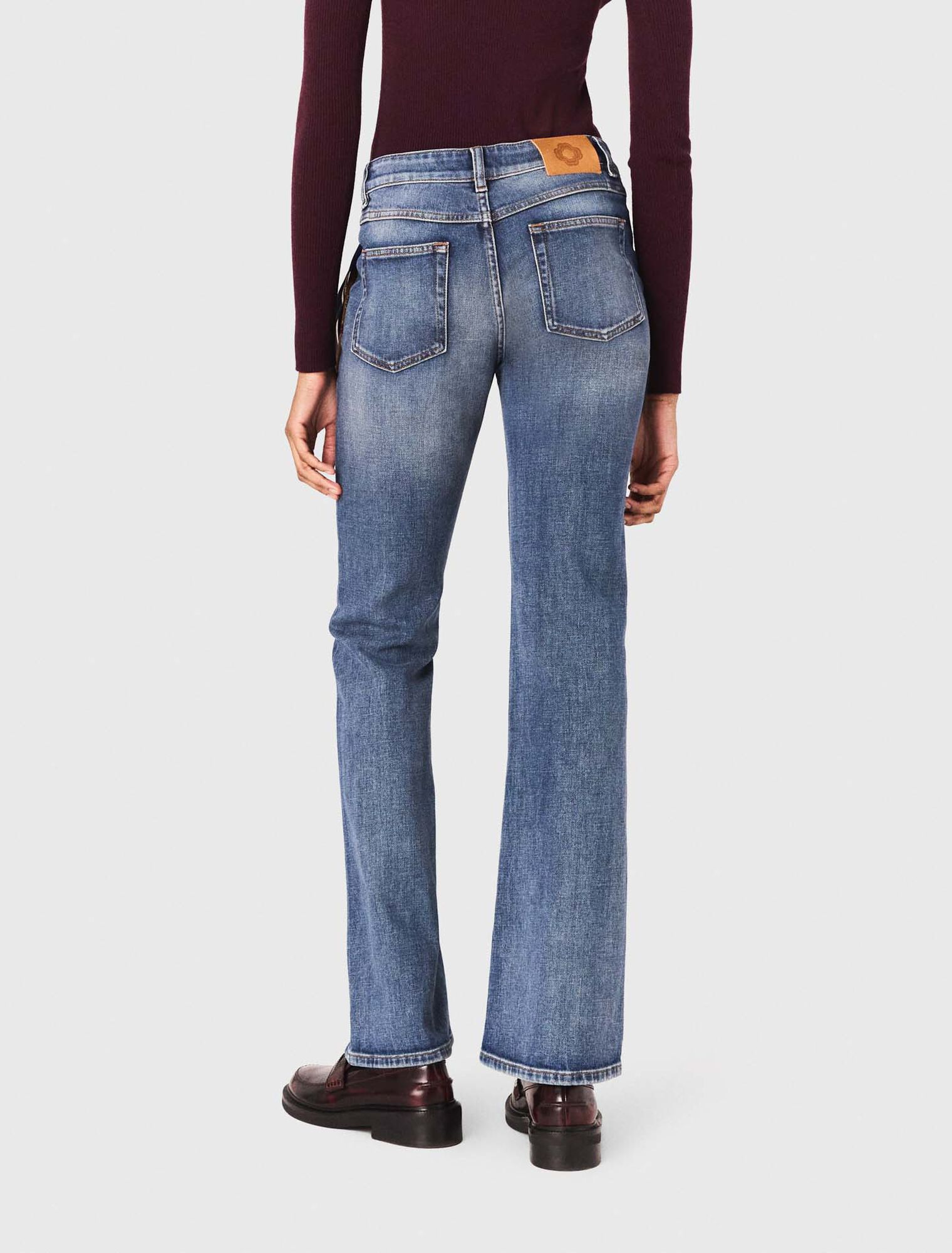 Jean bootcut à poches zippées