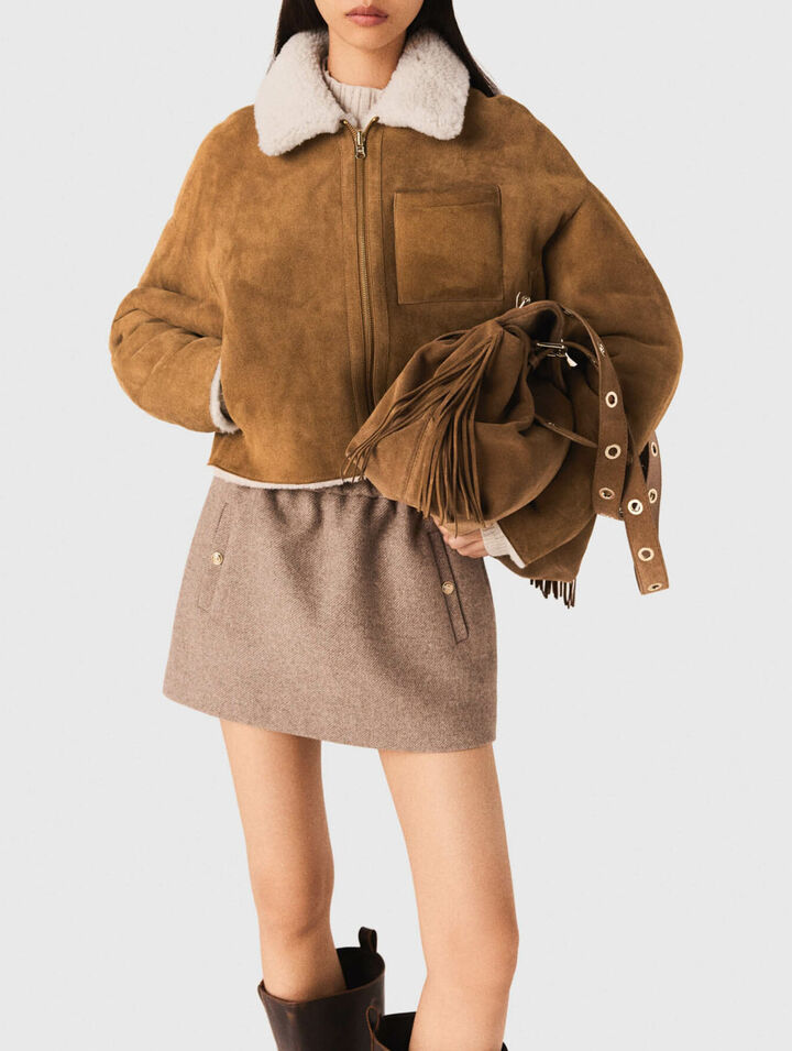 Manteau en peau lain&eacute;e r&eacute;versible