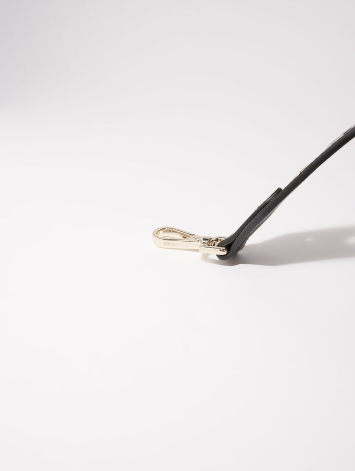 Bandoulière en cuir et œillets