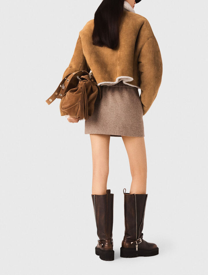 Manteau en peau lain&eacute;e r&eacute;versible