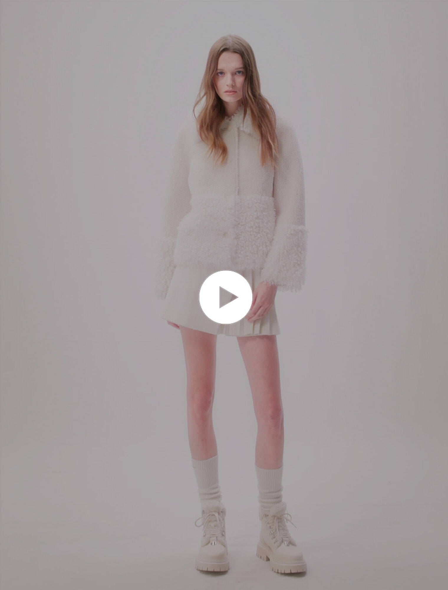 Manteau court fausse fourrure