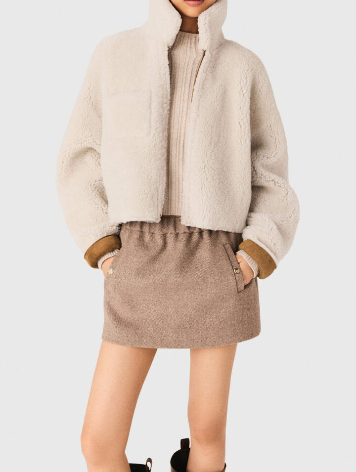 Manteau en peau lain&eacute;e r&eacute;versible