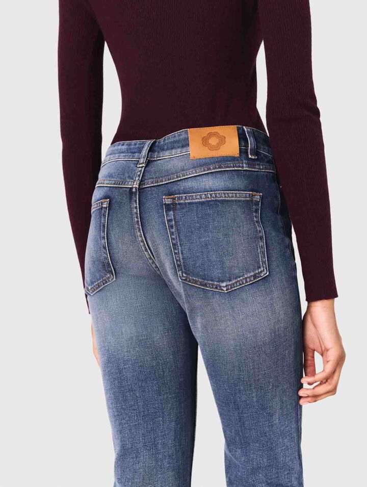 Jean bootcut à poches zippées