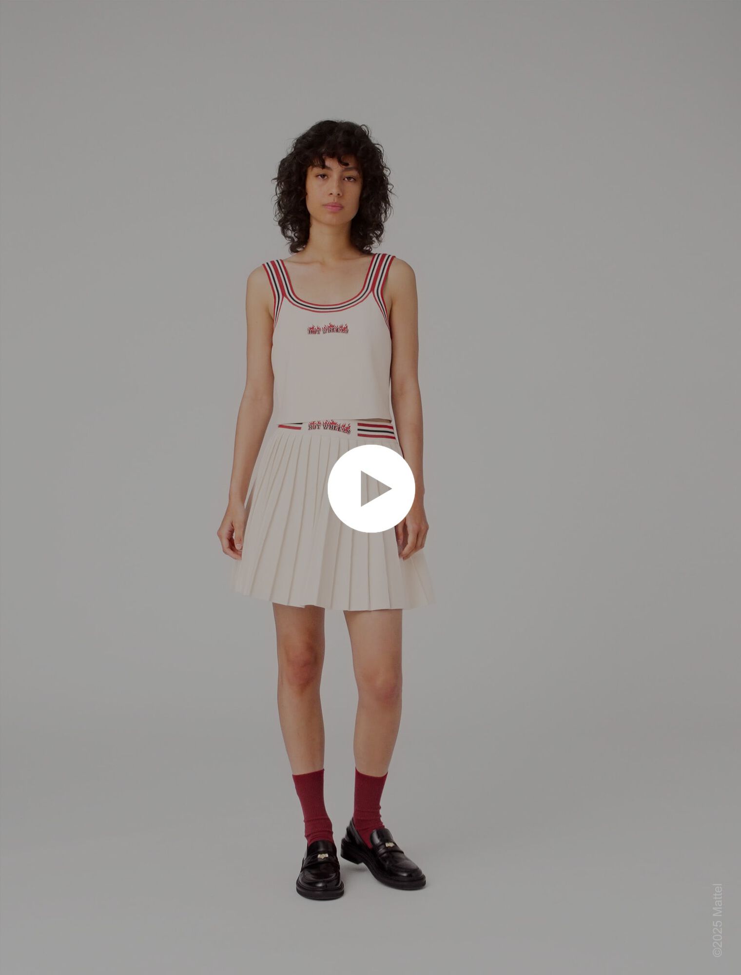 Jupe courte plissée en maille