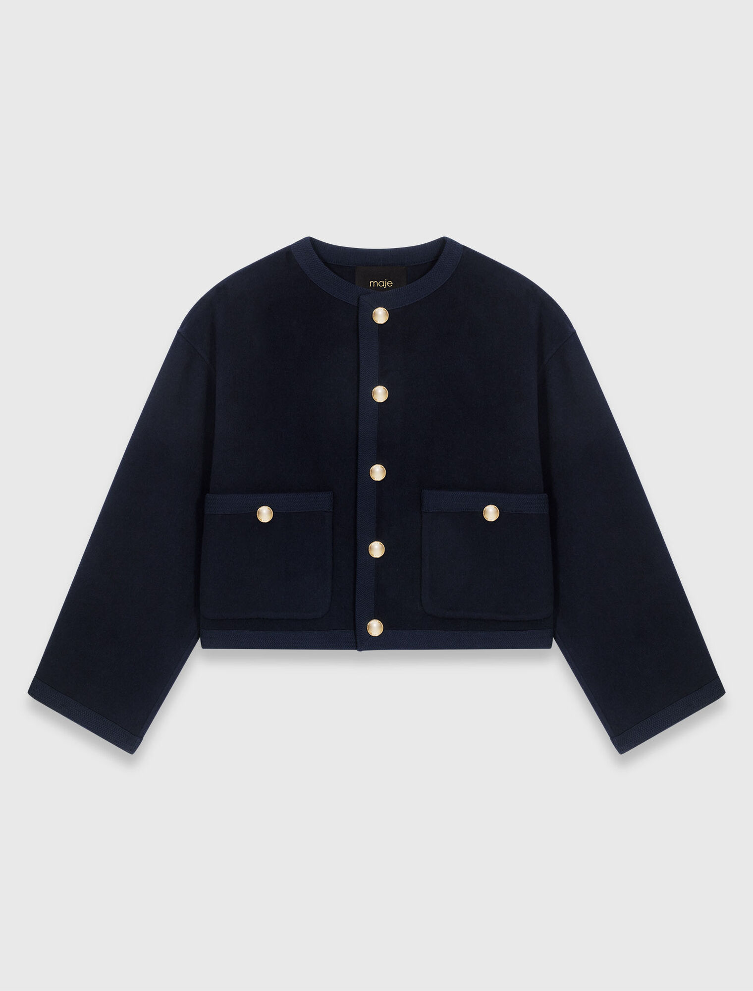 Veste double face et galons tress&eacute;s