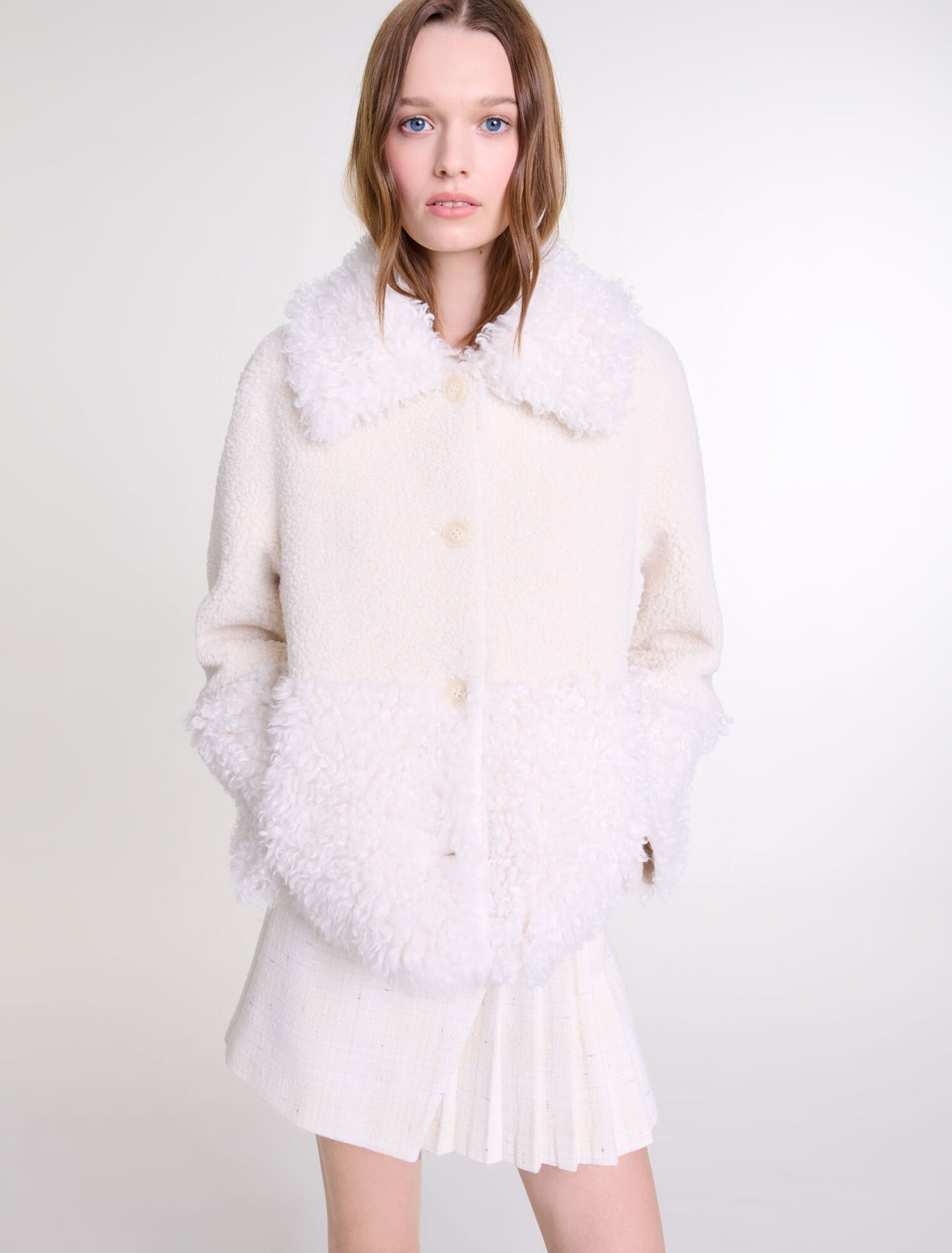 Manteau court fausse fourrure
