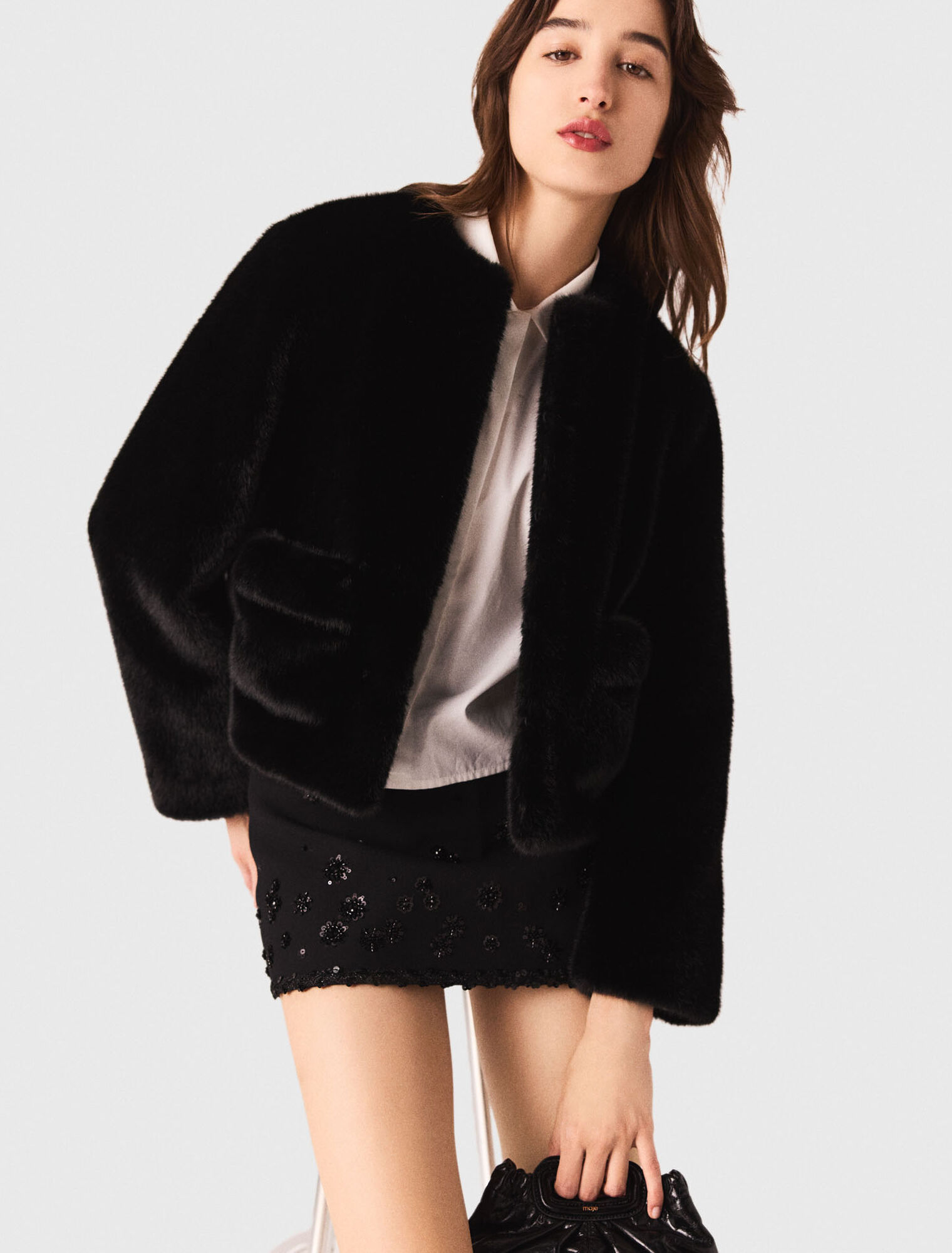 Manteau court en fausse fourrure