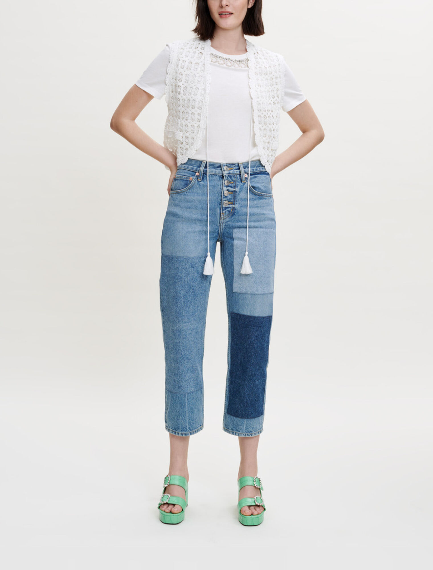 Petite veste sans manche en guipure