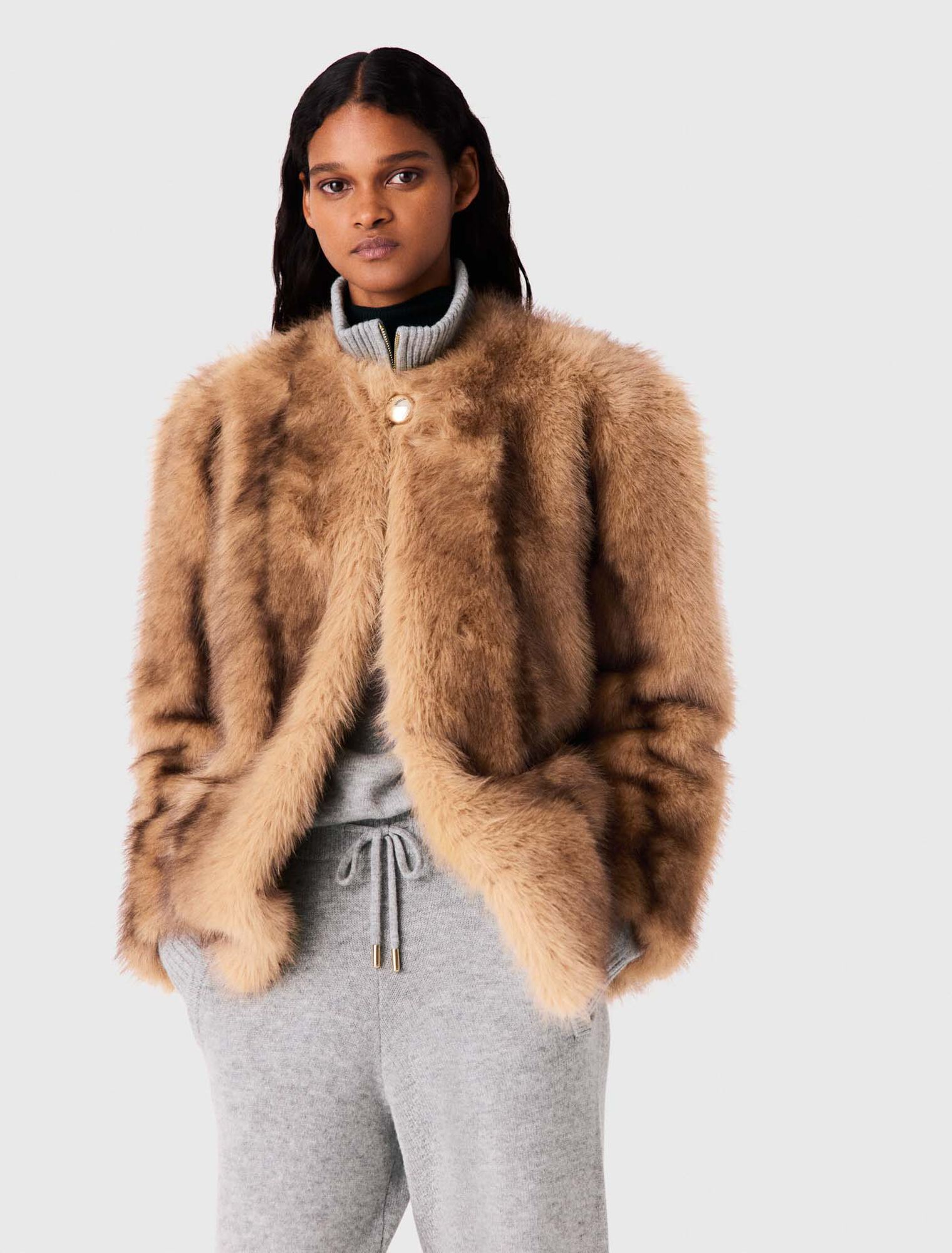 Manteau mi-long en fausse fourrure