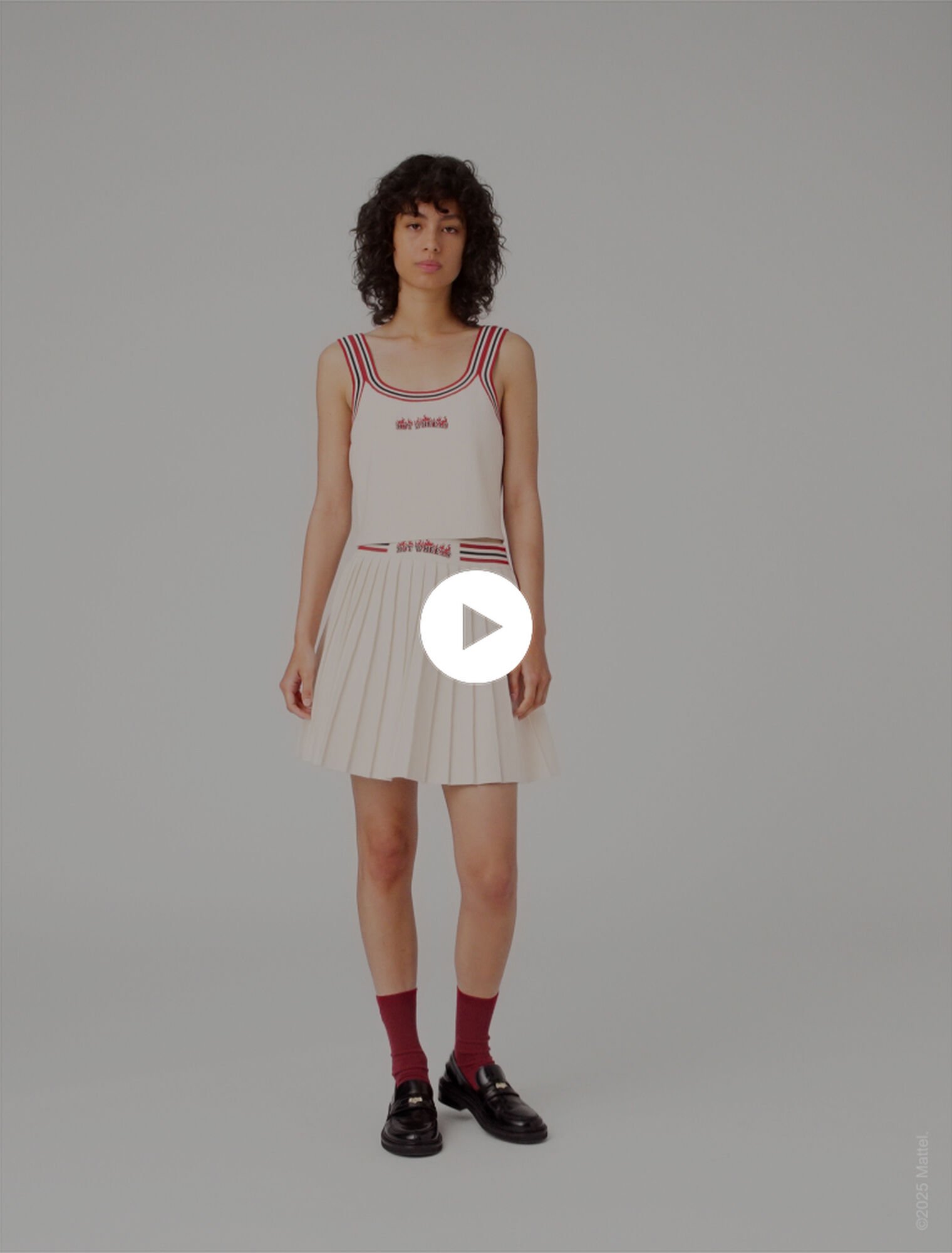 Jupe courte plissée en maille