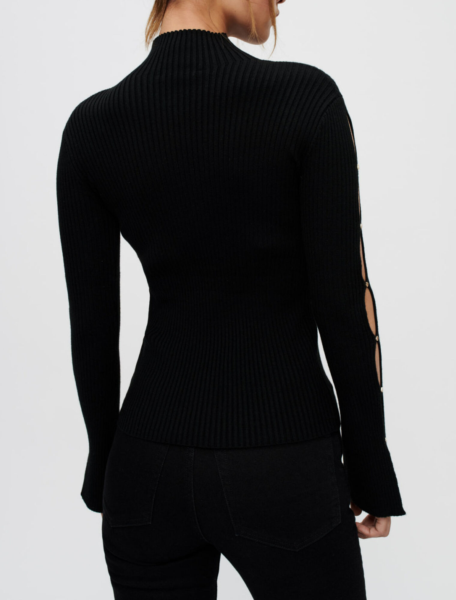 Pull près du corps ajouré aux manches