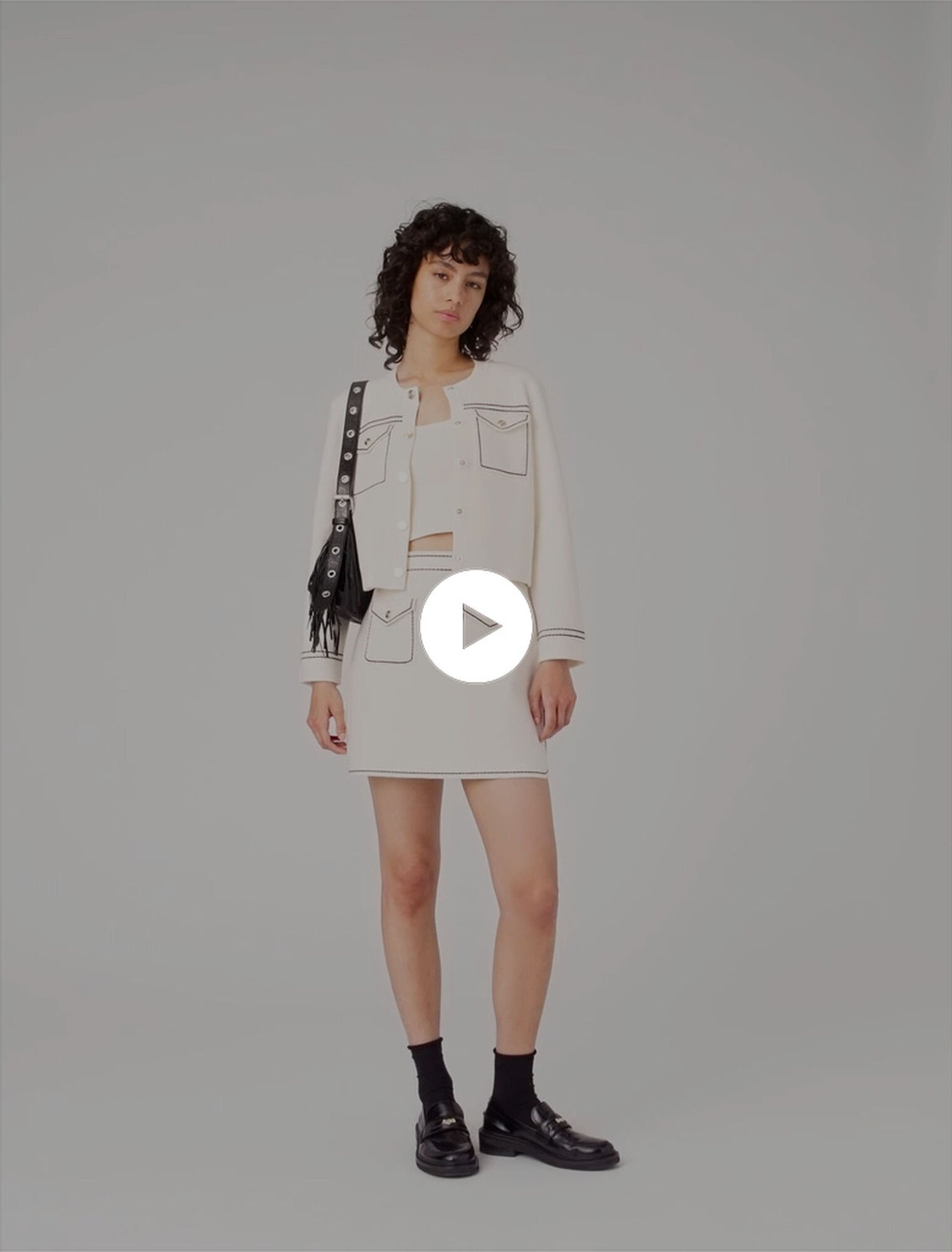 Jupe courte en maille surpiquée