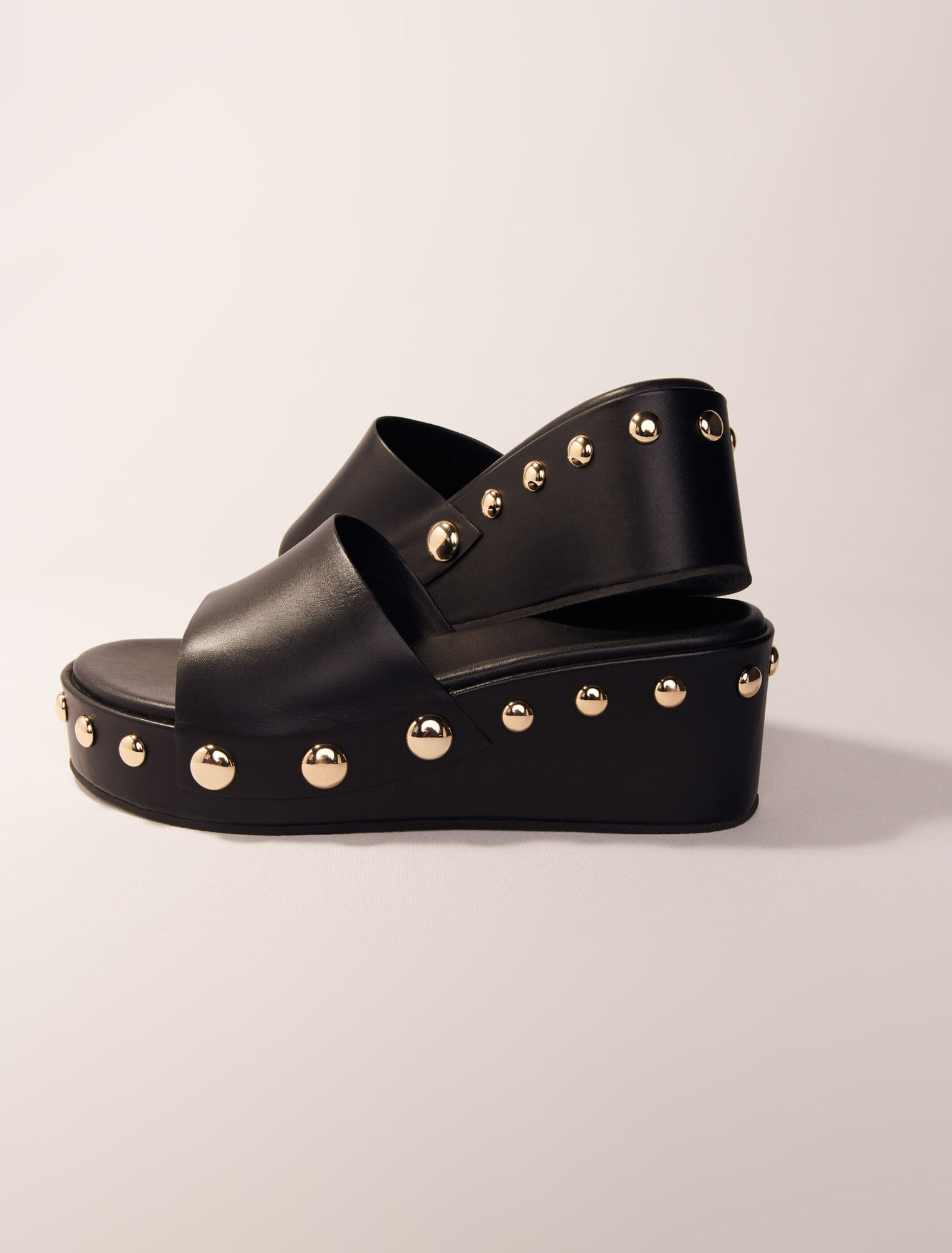 Mules compensées en cuir à studs