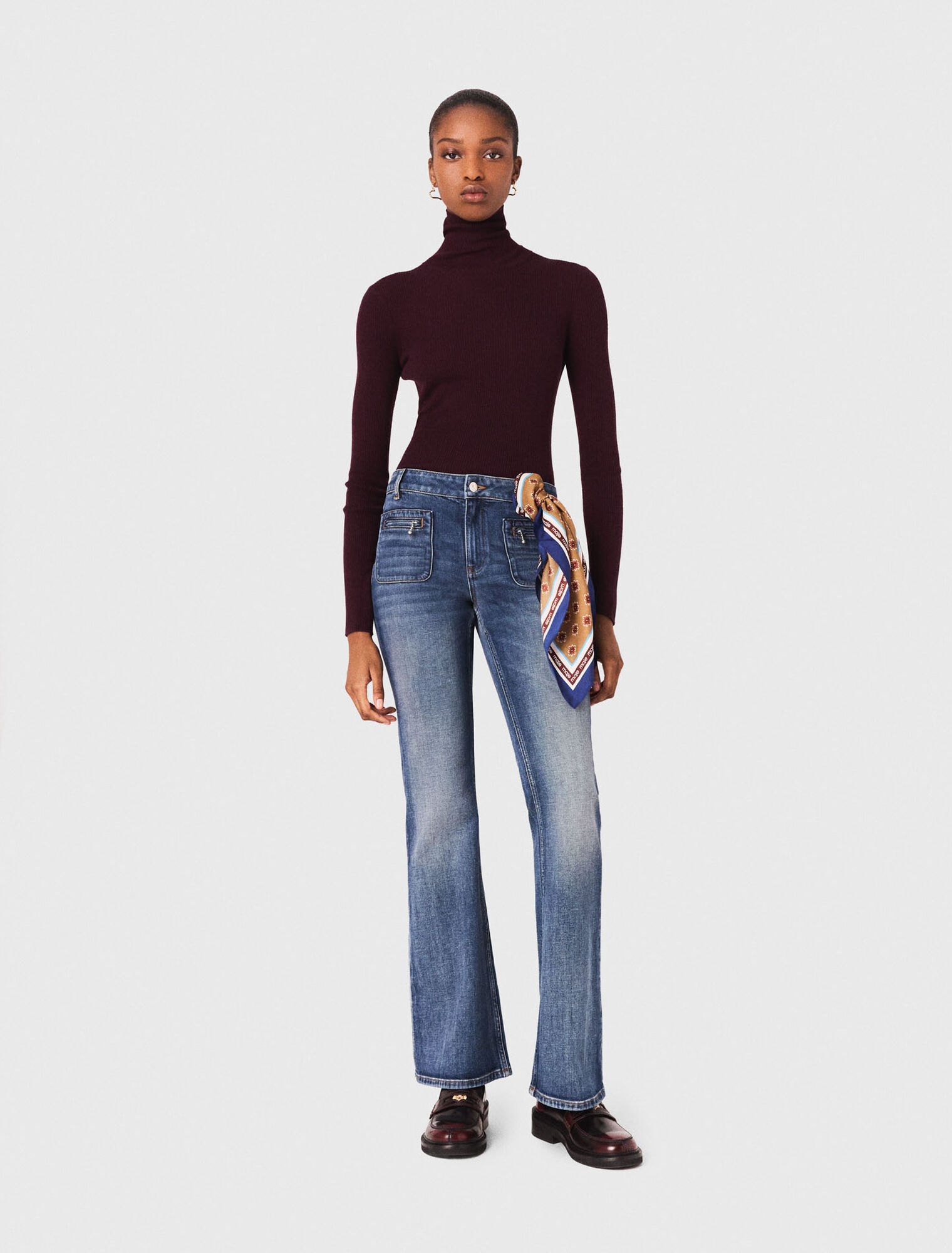 Jean bootcut à poches zippées