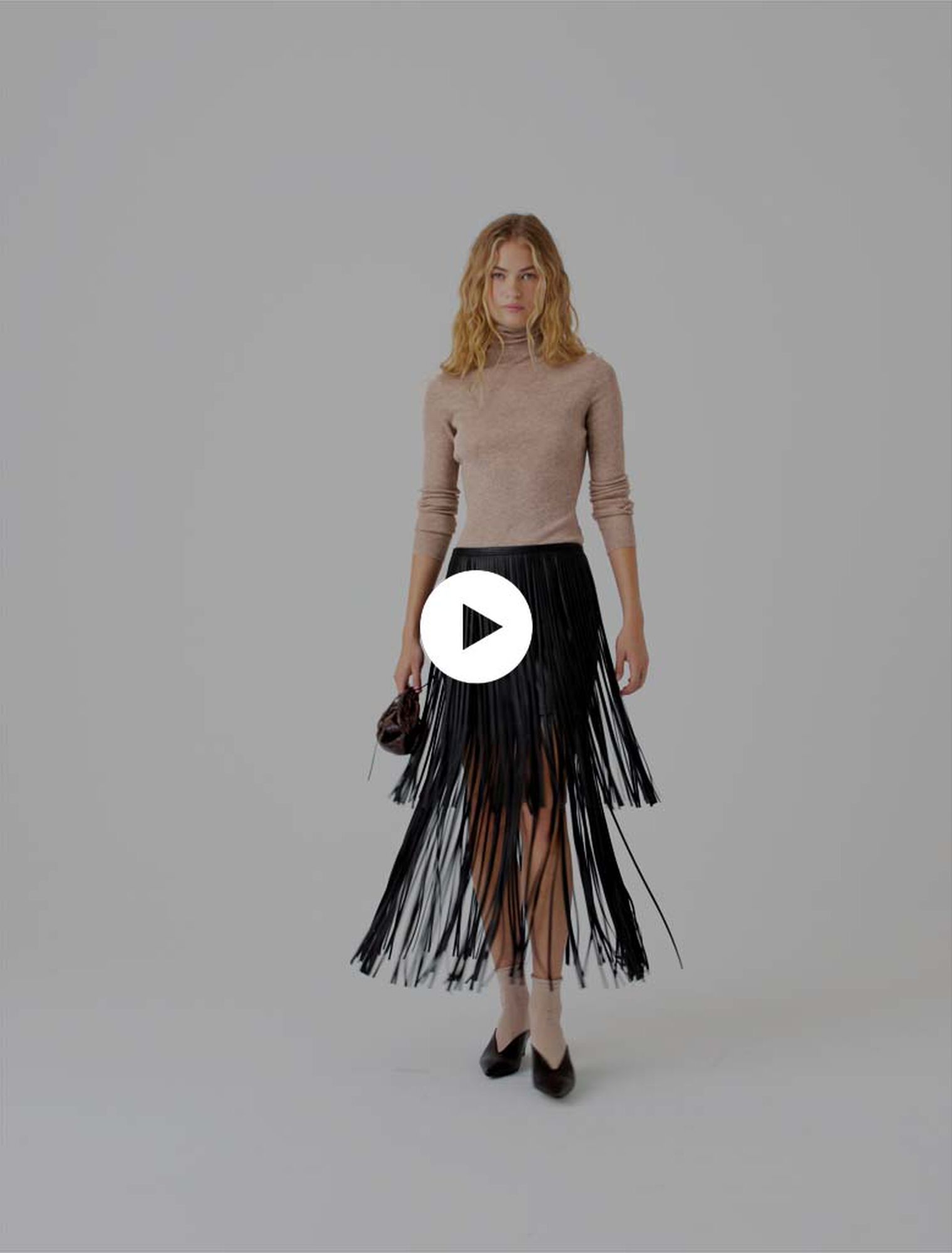 Jupe &agrave; franges en en simili cuir